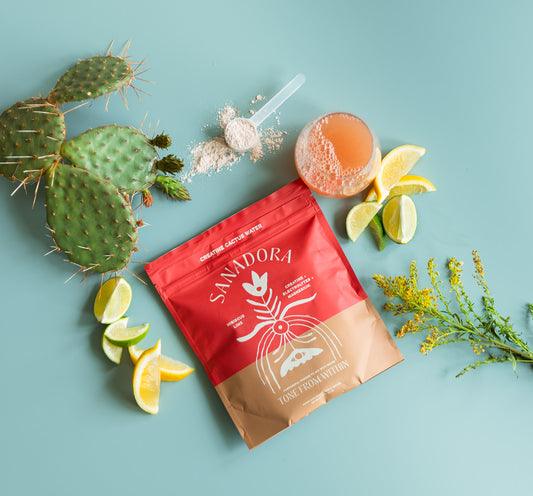 Sanadora Creatine Cactus Water pouch with cactus, lemon slices, and a drink on a light blue background