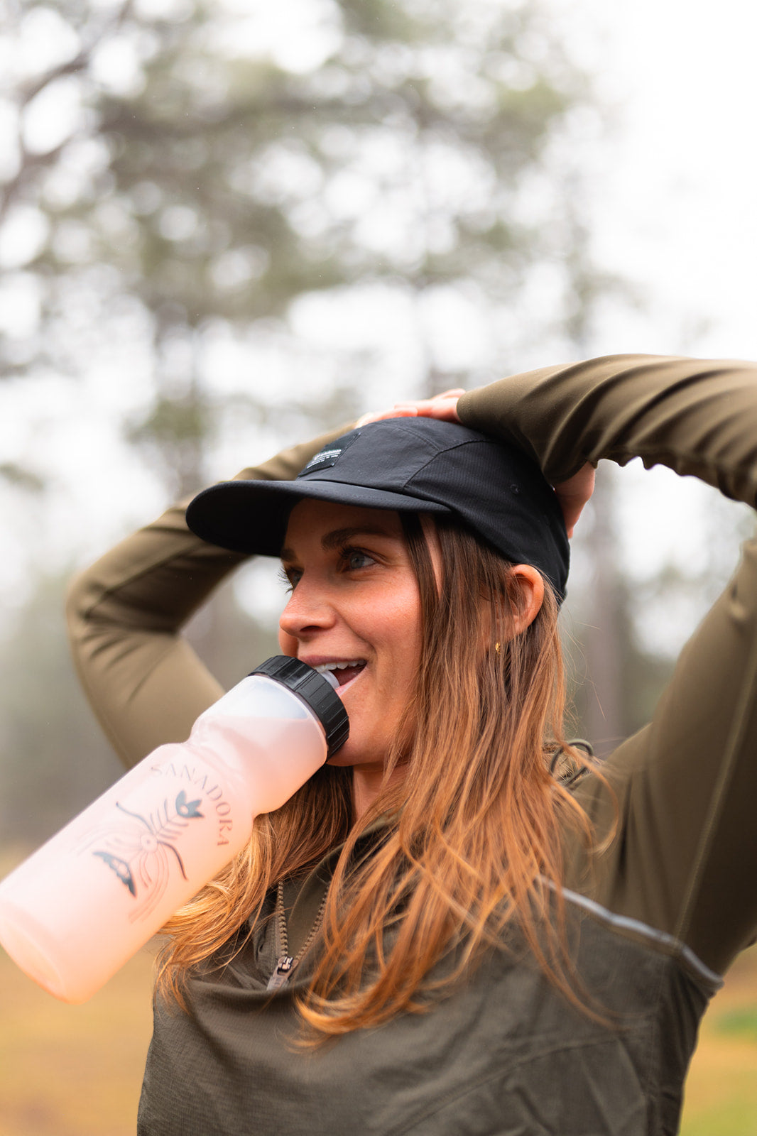 Woman outdoors drinking Creatine Cactus Water